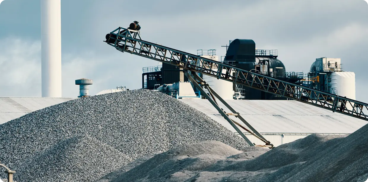 Industrial site with gravel conveyor belt.